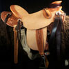 Wade tree, 15 inch seat, Gullet - 7 and 1/2 inch by 6 and 1/4 inch by 4 inch, Horn 4&1/2 inch round, 90 degree bars, 7/8ths full in-skirt riggin, Cheyenne Roll, Buckaroo outside leathers, half-breed Wade Saddle built and tooled with original floral and border design by Keith Valley.